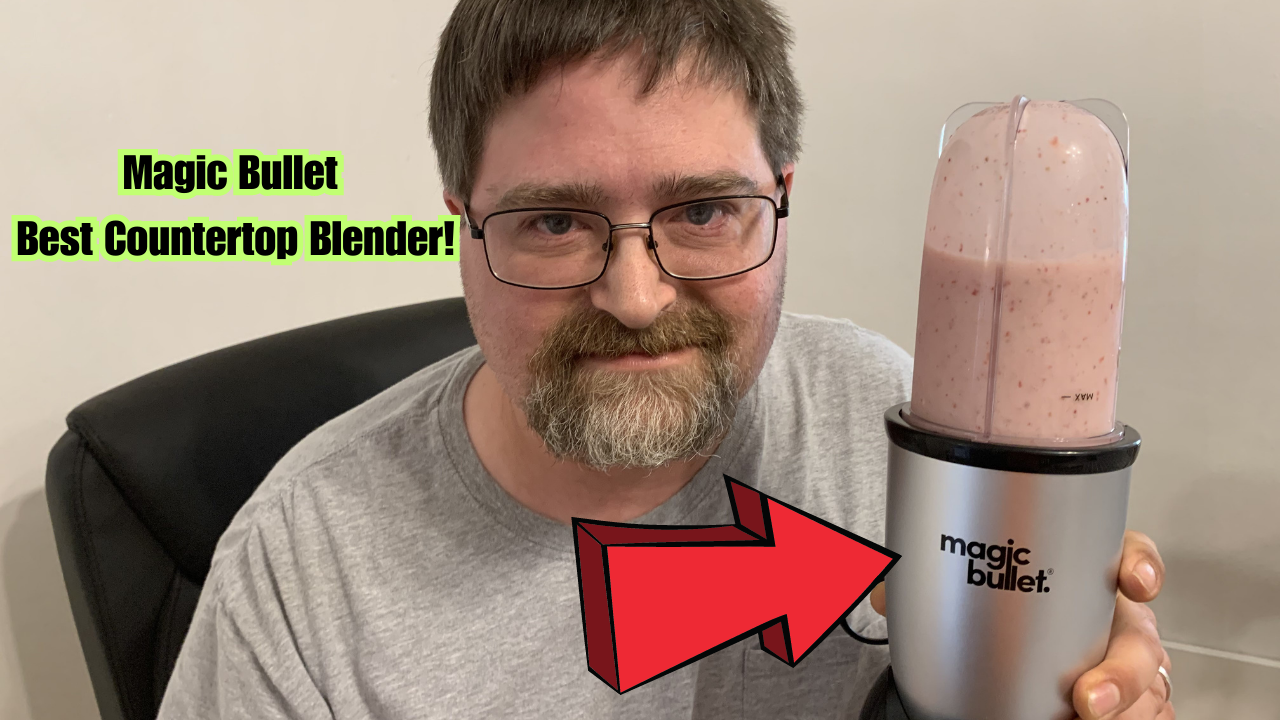 Man holding the magic bullet countertop blender