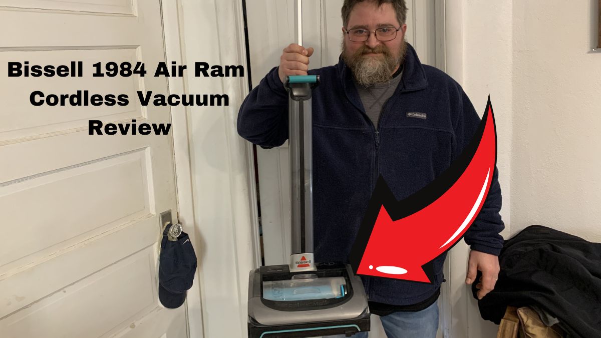 Man holding the Bissell 1984 Air Ram Cordless Vacuum