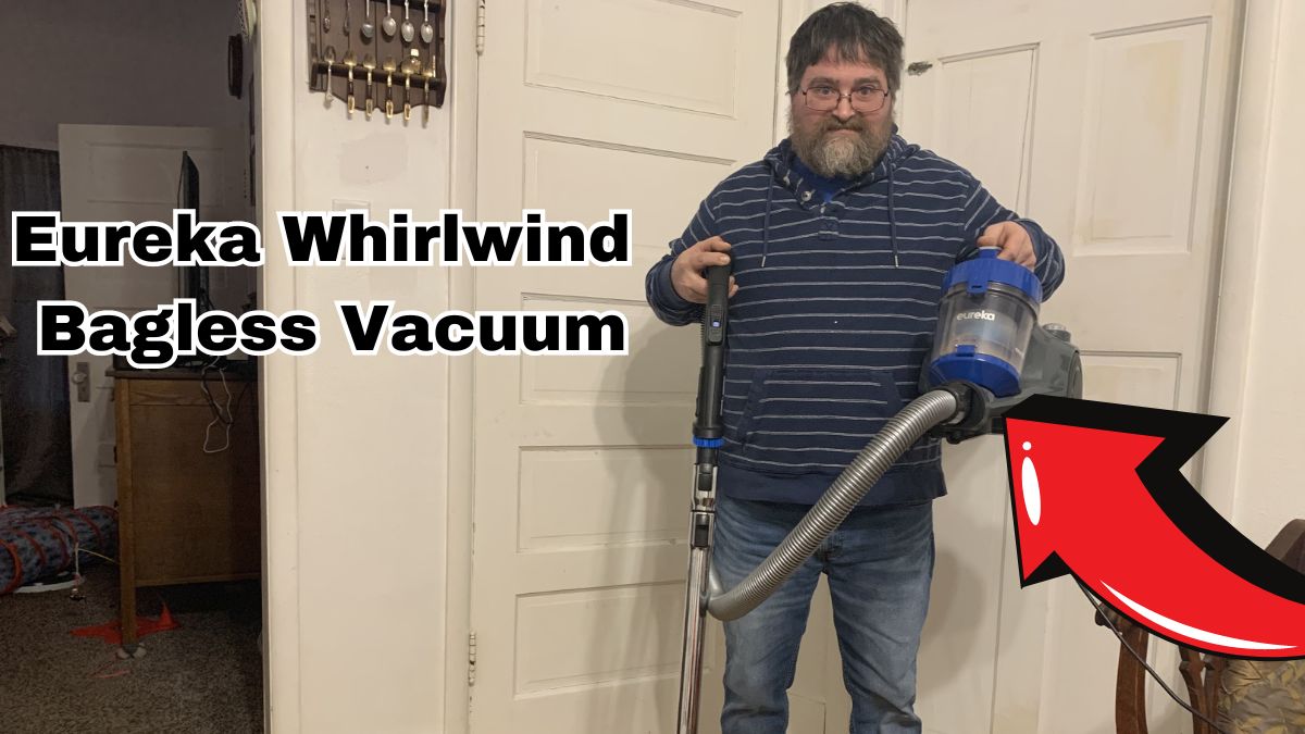 Man holding the Eureka Whirlwind Bagless Vacuum
